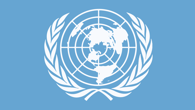 Barnkonventionens symbol med världskartan i mitten.